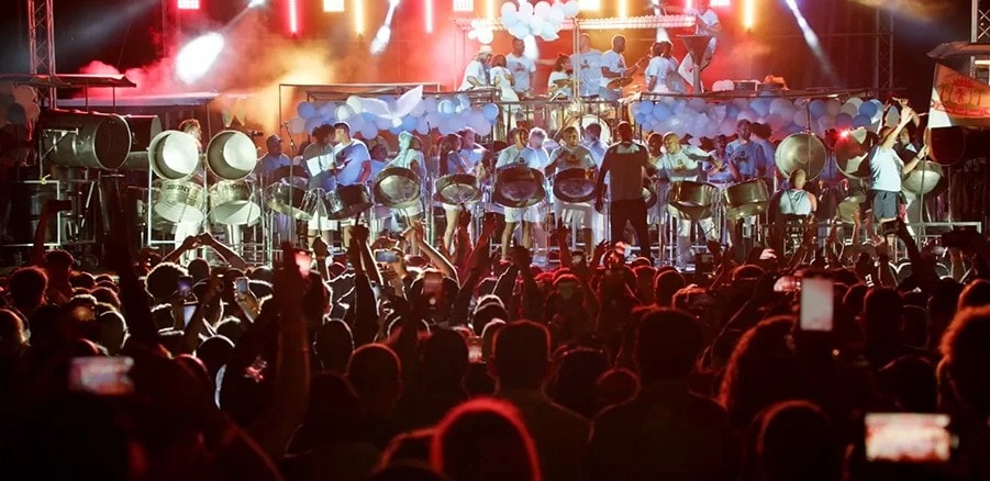 Vibrant concert with steel drums and crowd