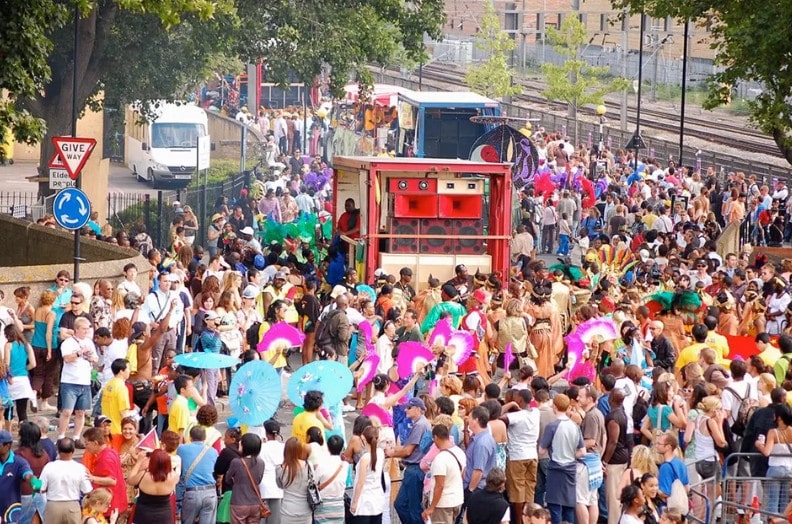 Vibrant carnival crowd celebrating together.